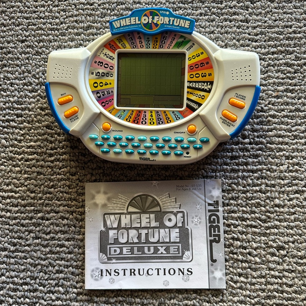 Tiger Wheel of Fortune Deluxe Electronic Handheld LCD Screen Video Game 1999